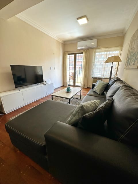 Family Apartment, 3 Bedrooms | Living area | 55-inch flat-screen TV with cable channels