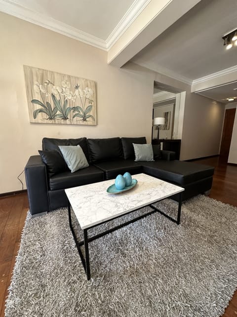 Family Apartment, 3 Bedrooms | Living area | 55-inch flat-screen TV with cable channels