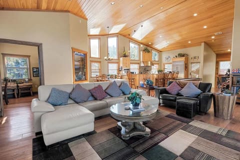 Main Living area- Upper level. Large couch, love seat, gaming table, 65" smart tv, gas fireplace, and shuffle board. Open to dining area, kitchen, office/room5, and upper decks! (new couches were added, pics coming soon!