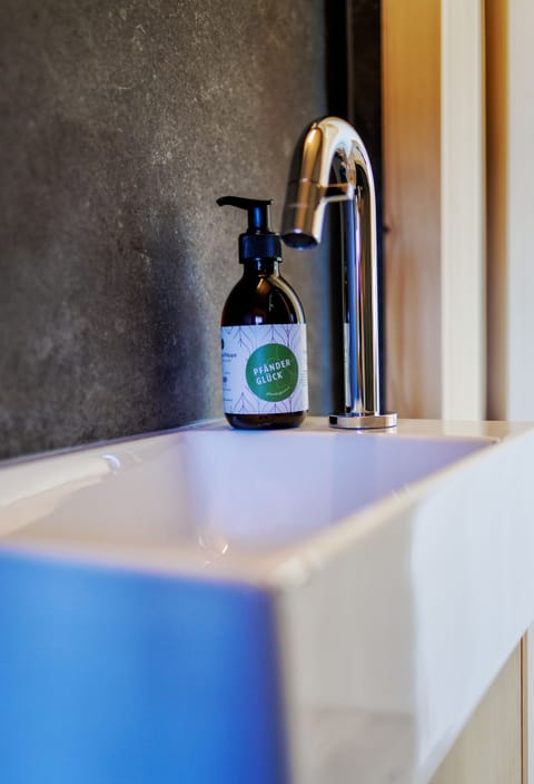 Separate tub and shower, rainfall showerhead, hair dryer, bathrobes