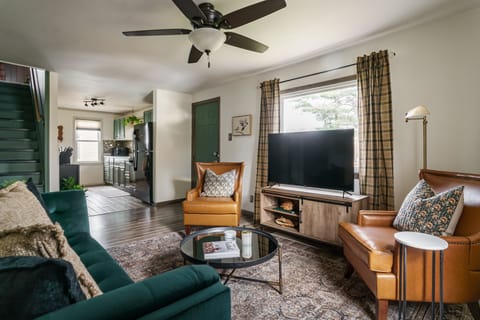 Living rom with an old school glam interior + tv and cozy sofa sets