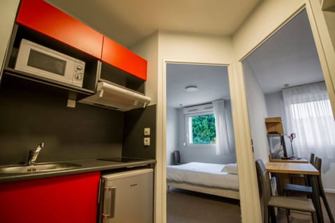 Apartment | Private kitchenette | Fridge, microwave, stovetop, cookware/dishes/utensils