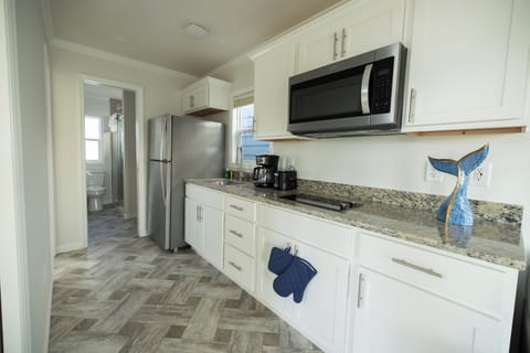 Bungalow | Private kitchen | Full-size fridge, microwave, stovetop, toaster