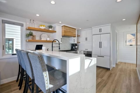 KITCHEN: features a spacious countertop with casual seating for four — perfect for breakfast, coffee chats, or keeping the chef company while meals are prepared