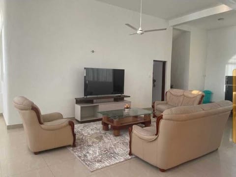 Family House | Living area | 24-inch Smart TV with digital channels