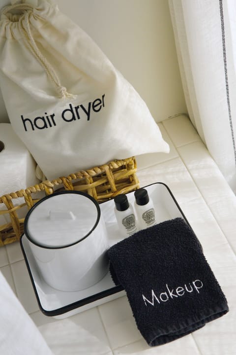 Designer toiletries, hair dryer, bathrobes, towels