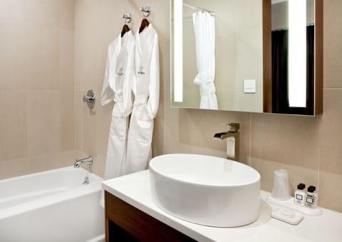 Suite, 1 Queen Bed | Bathroom | Shower, hair dryer, bathrobes, towels