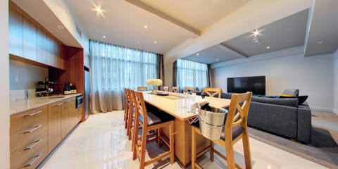 Four Bedroom Suite | Living area | 50-inch flat-screen TV with cable channels, TV