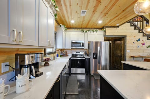 A fully stocked kitchen provides everything you need for a meal in the cabin