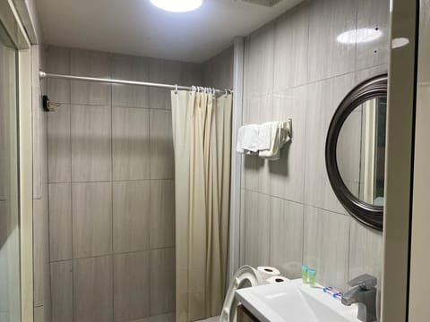 Economy Single Room, Non Smoking, Private Bathroom | Bathroom | Hair dryer, towels, soap, shampoo