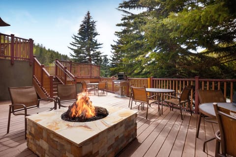 Outdoor sitting area with fire pits.