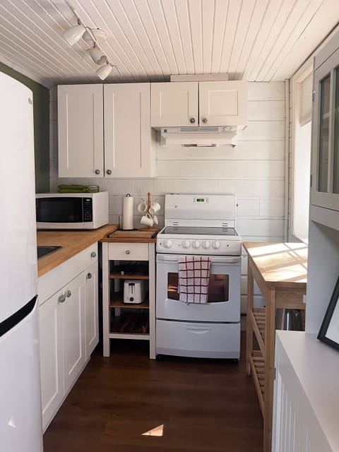 The kitchen is compact, with everything you need for basic cooking.