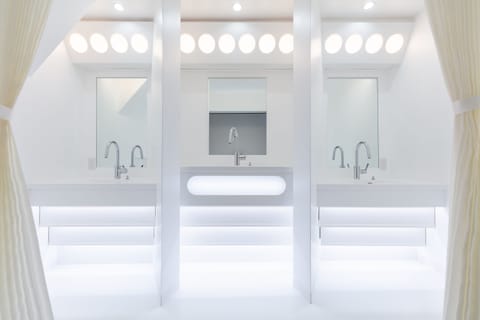 Designer toiletries, hair dryer, slippers, towels