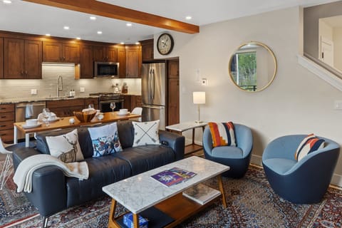 The first level opens up to a large living room, kitchen and spacious deck with plenty of natural light and a gas fireplace.