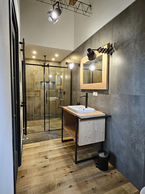 Superior Studio | Bathroom | Free toiletries, hair dryer, slippers