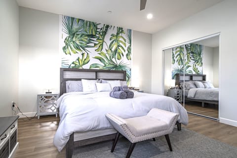 Bedroom #1: Master bedroom with a private bathroom, work desk, and a balcony