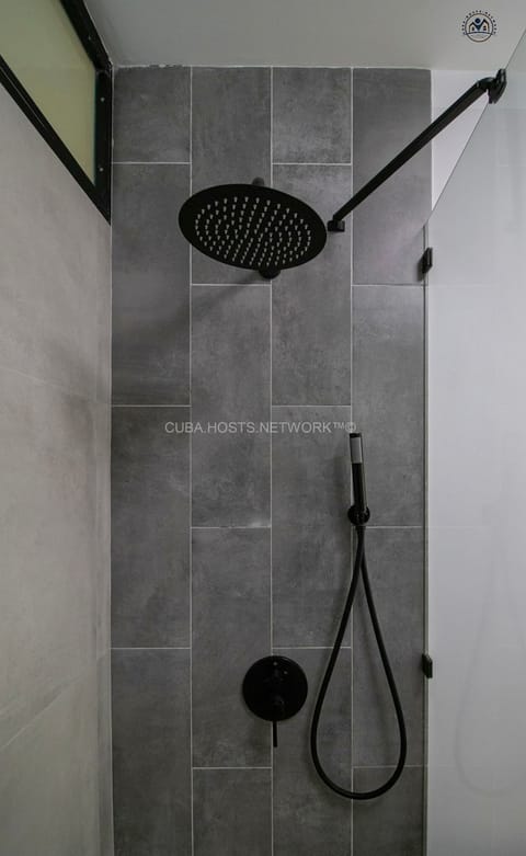 Luxury Apartment | Bathroom | Rainfall showerhead, hair dryer, towels