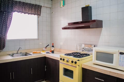 Family Apartment | Private kitchen | Full-size fridge, microwave, blender, cookware/dishes/utensils