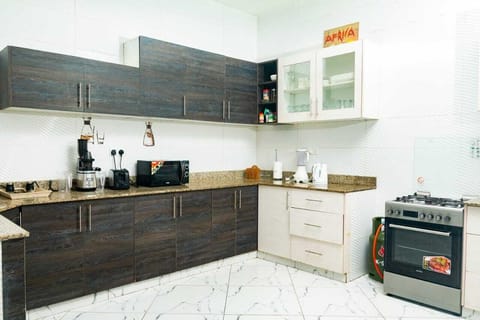 Family Apartment | Private kitchen | Fridge, microwave, cookware/dishes/utensils, dining tables