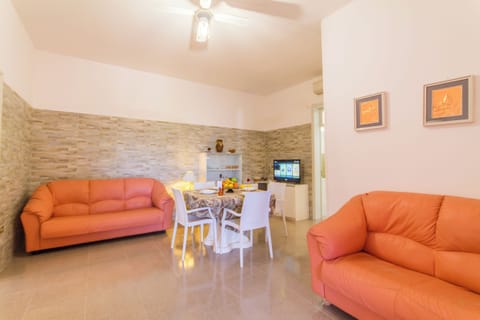 Standard House, 2 Bedrooms (Villetta Rossa with garden) | Living room | 21-inch flat-screen TV with digital channels