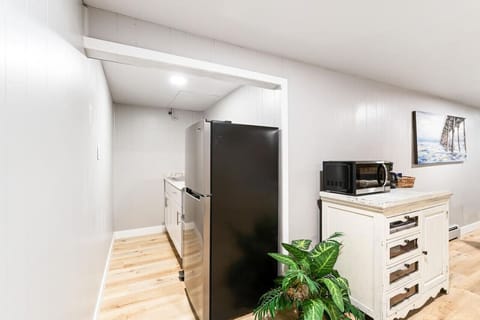 Full size fridge and kitchen area