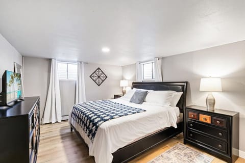 Comfortable King bed with Smart TV and room darkening curtains