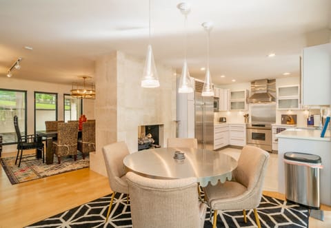 Cozy up by the fireplace in our sleek dining area or start your day with a warm cup and good vibes