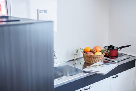 Fridge, microwave, stovetop, coffee/tea maker