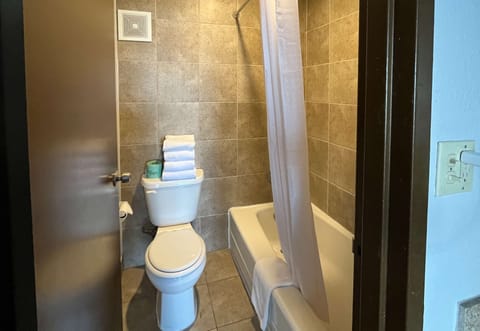 Combined shower/tub, hair dryer, towels, soap