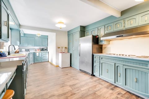 Large kitchen with coffee maker, grinder, microwave, crockpot, blender and serve ware. (1)