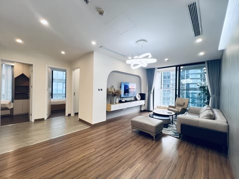 Superior Apartment | Living area | 55-inch Smart TV with cable channels, pay movies