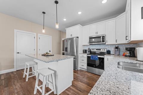 Full Kitchen with Major Appliances & Bar Seating