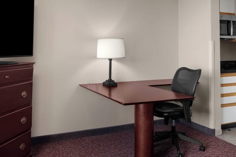 Premium bedding, desk, laptop workspace, blackout drapes