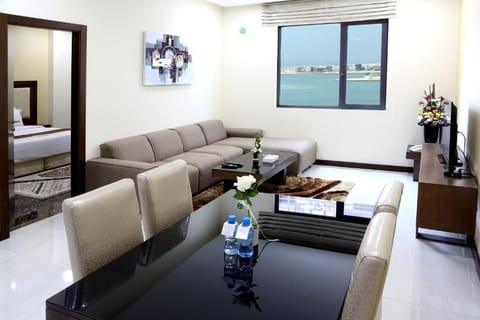 Deluxe Suite | Living area | Flat-screen TV