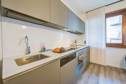 Family Apartment, 1 Bedroom, Refrigerator & Microwave (Domus Raffaella) | Private kitchen | Fridge, microwave, oven, stovetop
