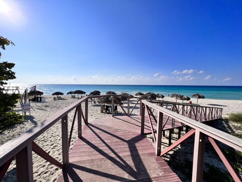 Beach nearby, white sand, beach towels