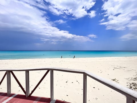 Beach nearby, white sand, beach towels