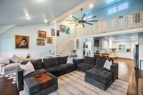 The living room, located on the main level, is where you can relax on the Lovesac couch and watch some movies with the family.