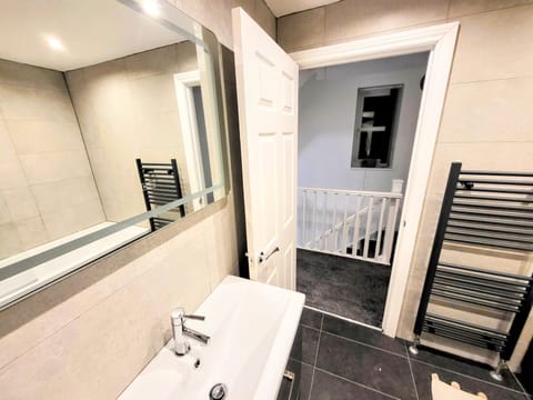 Standard House | Bathroom | Separate tub and shower, rainfall showerhead, towels