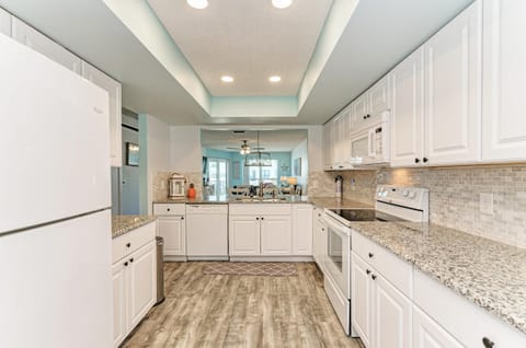 Condo, Multiple Beds, Pool View (Anna Maria Island Beach Waves) | Private kitchen | Highchair