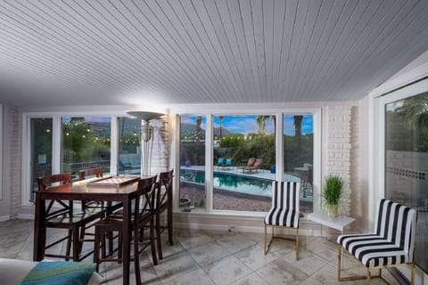 Game table area with views of the pool & outdoor patios.