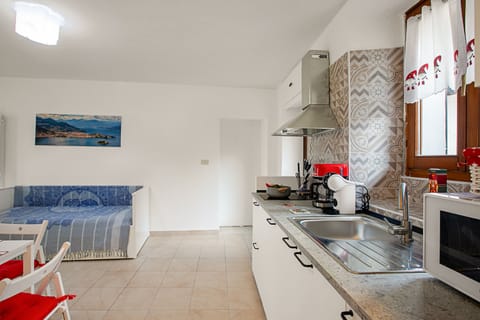 Standard Apartment, 1 Bedroom (Lami Apartment Intra Center) | Private kitchen | Microwave, stovetop, cookware/dishes/utensils