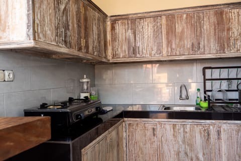 Deluxe Villa | Private kitchen | Fridge, stovetop, electric kettle, toaster