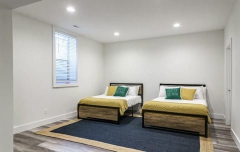 Open bedroom 6 in the basement with 2 double beds