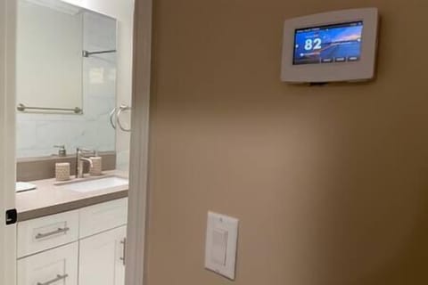 Thermostat for central air and heater