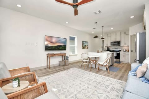 The open concept of the family room creates an environment perfect for relaxation, socializing, and entertaining.