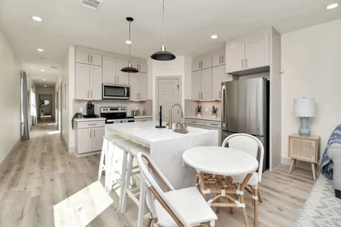 Enjoy a bar stool or the table and chairs in the kitchen seating area. comfortably seats 5.