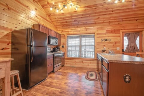 The kitchen is fully equipped with appliances, utensils, cookware, and tableware. Dishwasher and microwave are new as of 2023.