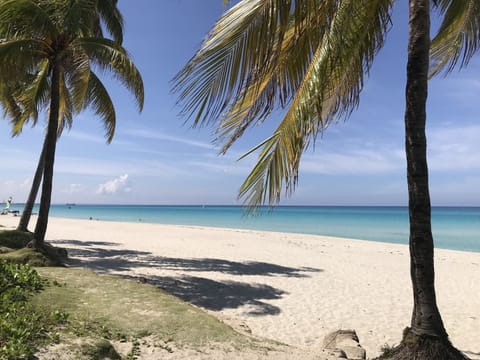 Beach nearby, white sand, beach towels