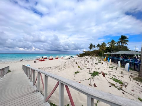 Beach nearby, white sand, beach towels